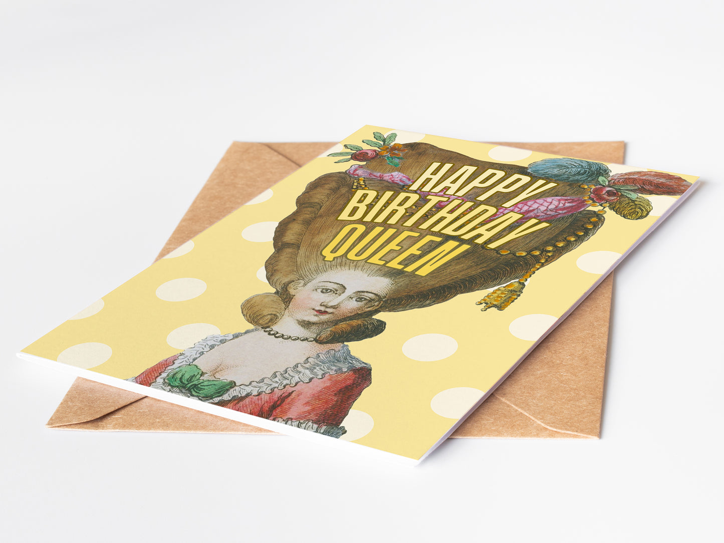 Greeting card with vintage-style illustration and 'Happy Birthday Queen' text on a polka dot background.