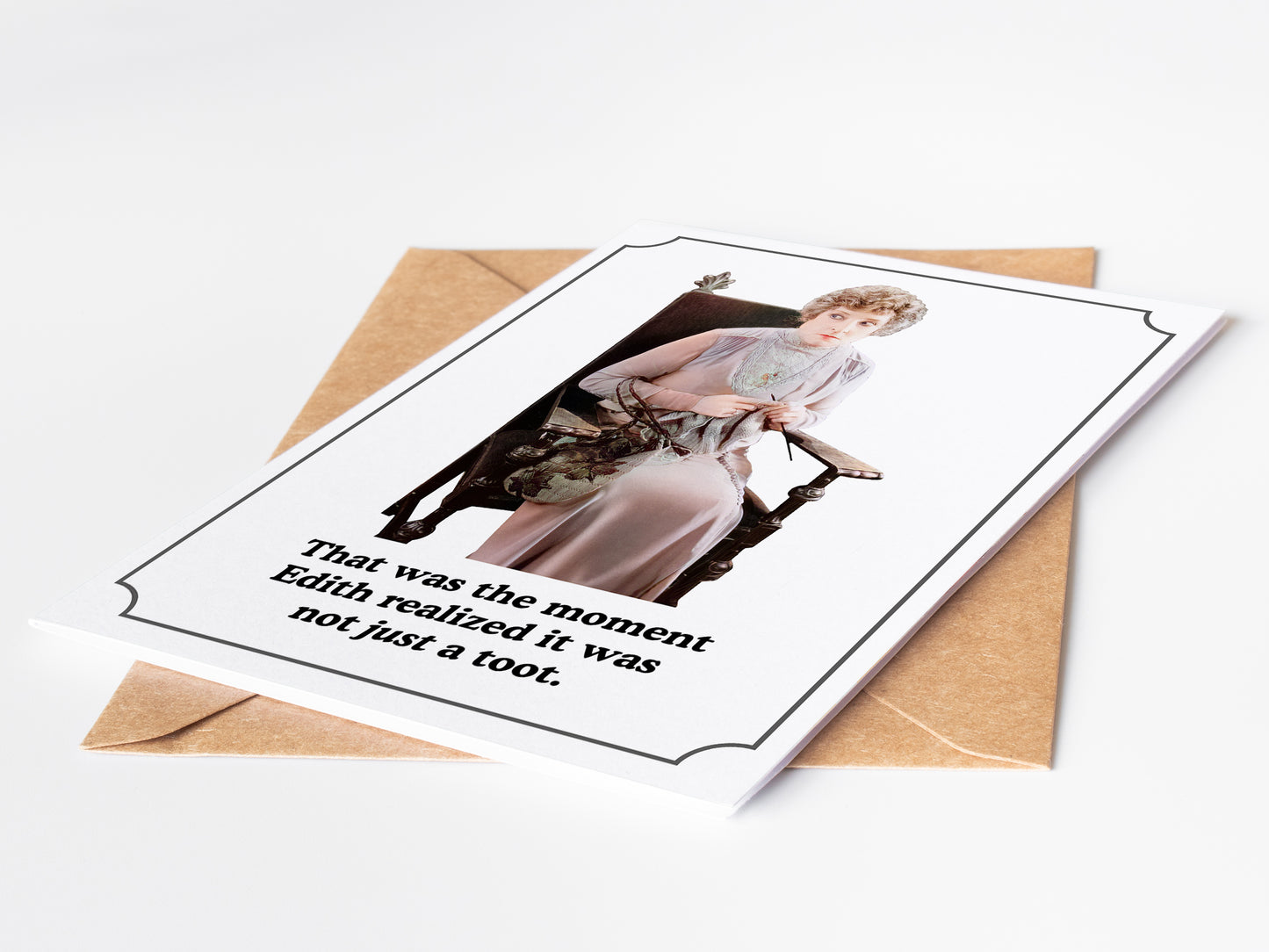 Greeting card with a humorous message and an envelope on a white background