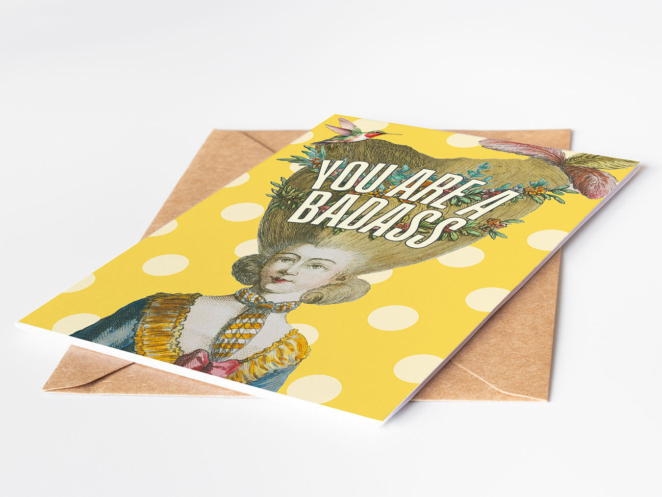 Greeting card with a vintage-style illustration and 'You Are A Badass' text on a yellow polka dot background.